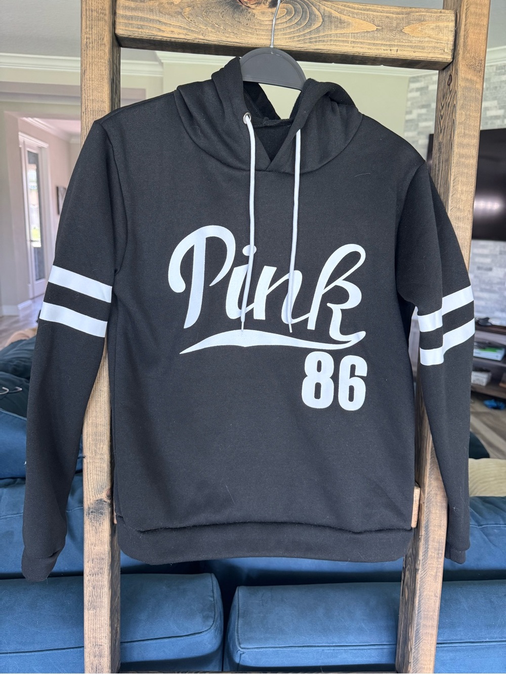 Black hoodie with White 'Pink‎ 86' Graphic